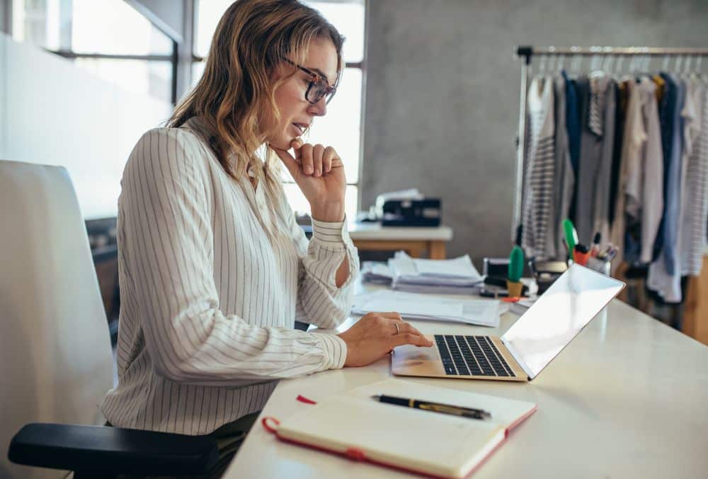 Lady Reviewing A Deed Of Company Arrangement On Her Laptop