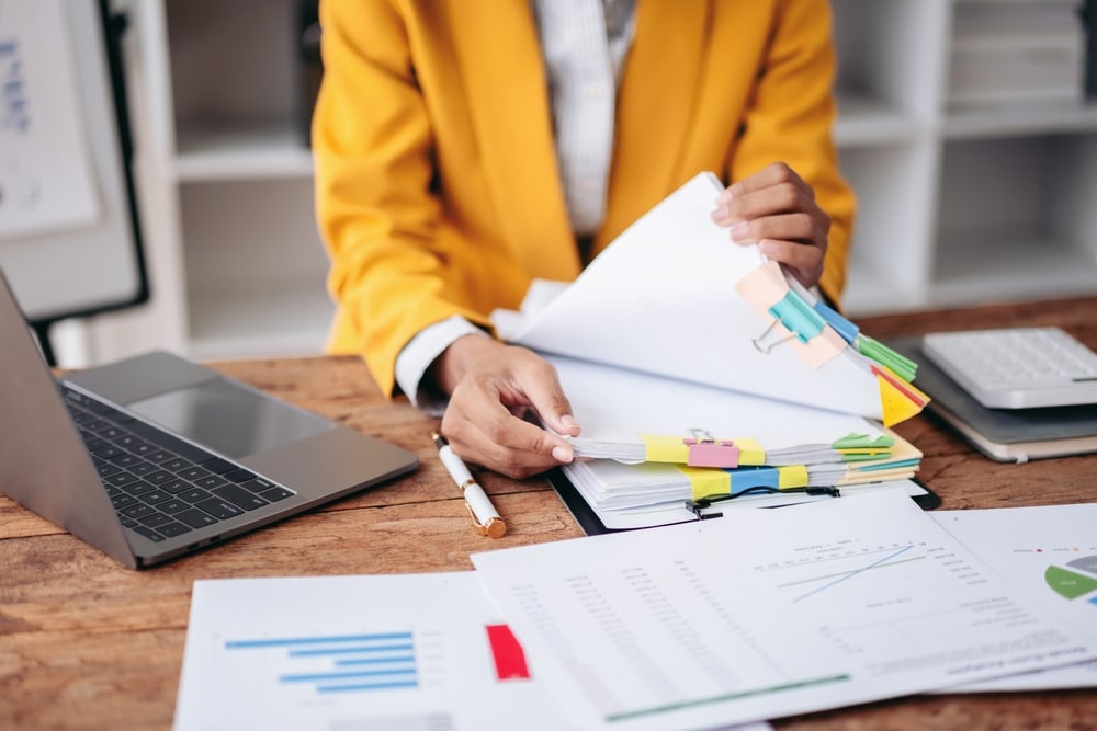 Small Business Owner In The Process Of Sorting Debt Refinance