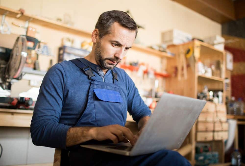 Company Director Reviewing A DPN On His Laptop